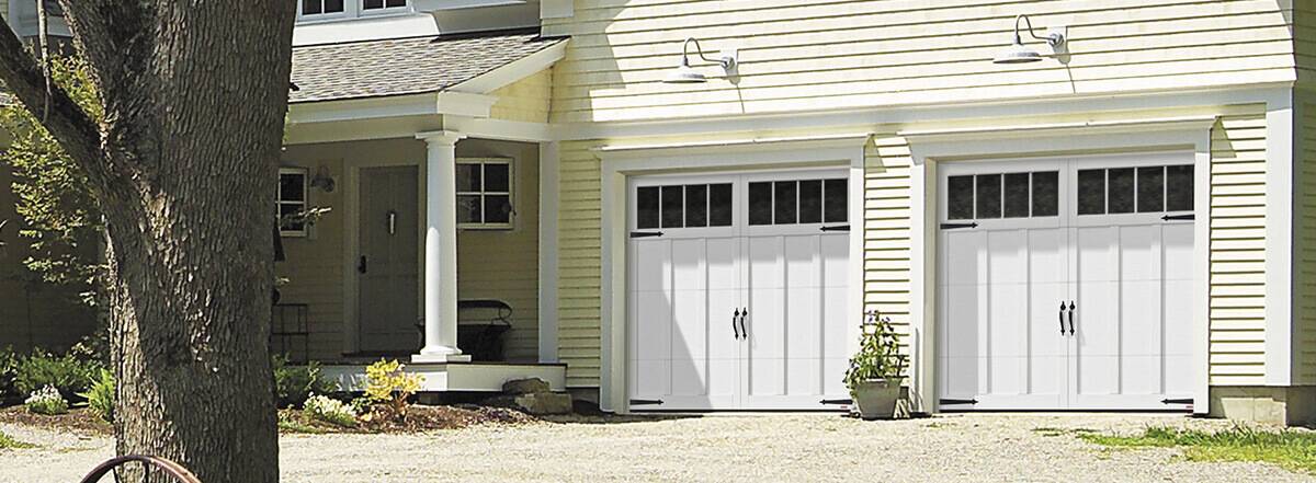 Eastman E-13, 9' x 7', Ice White doors and overlays, 4 vertical lite Orion windows